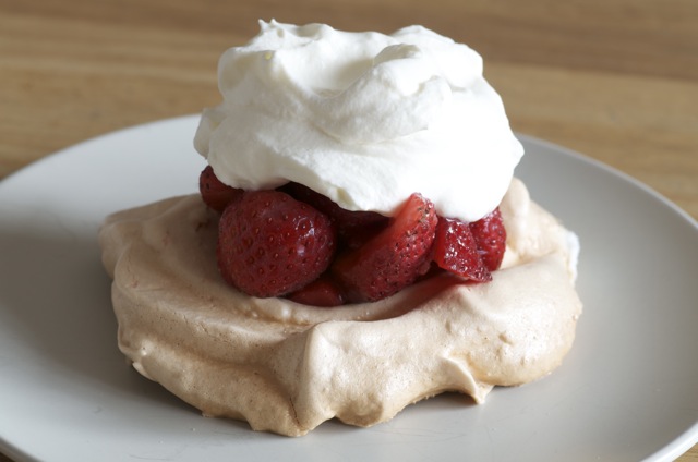 one way to eat pavlova, with strawberries and whipping cream